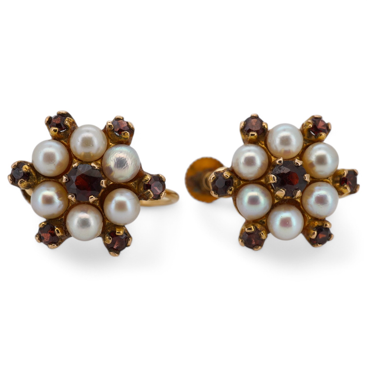 A pair of 9ct, cultured pearl and garnet set flower head ear clips, diameter 14mm, gross weight 4 grams. Condition - fair to good